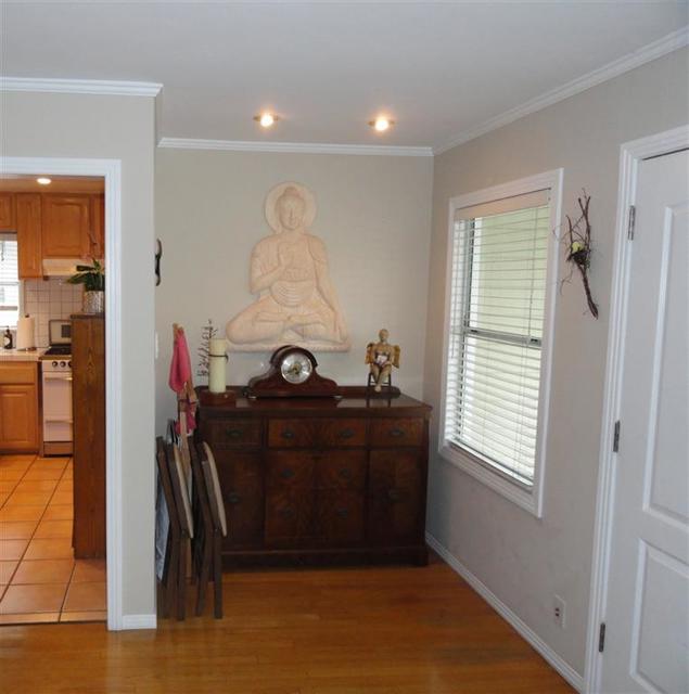 Living room looking east towards entrance to kitchen.