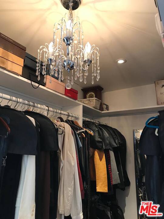 walk in closet w/chandelier