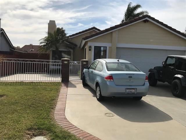 Low yard maintenance in front yard, with gated area.