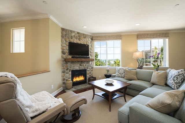 The family room has a custom built in fireplace mantel.