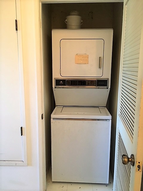 Stackable washer/dryer in closet.