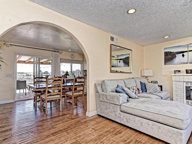 Beautiful archway creates a beautiful flow between living room and dining area