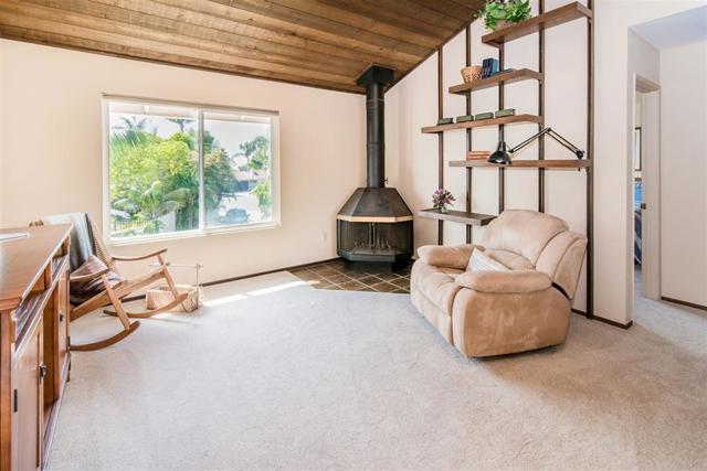 Upstairs great room/master suite fully permitted with wood burning fireplace and added in 1978.Peak ocean views from this west facing area.