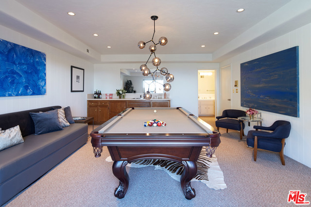 Entertainment room with ensuite full bathroom at pool level