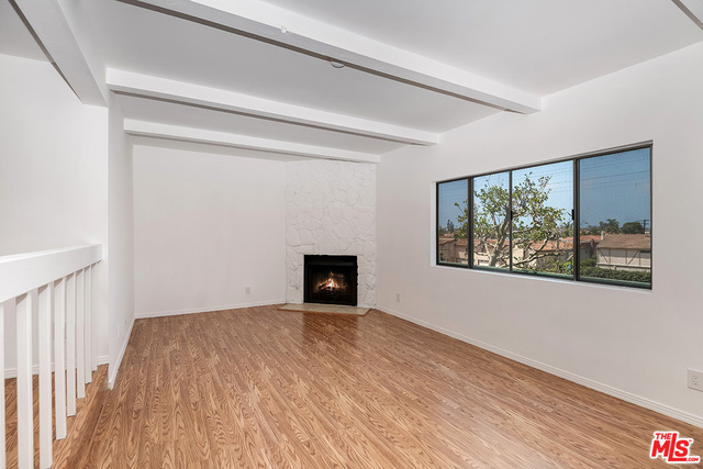 living room with large west facing window