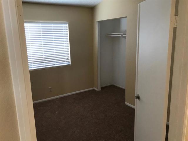 Master bedroom double door entry with all new carpet and fresh paint.