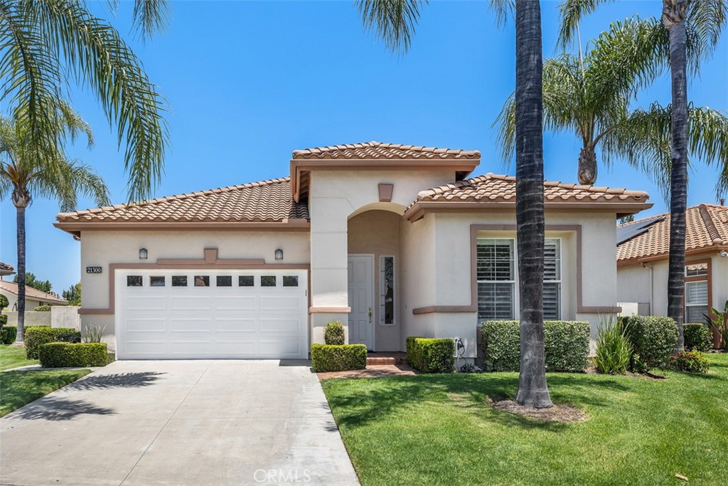 This lovely single-story home is located in the Palmia guard gated senior community. Featuring 2 bedroom, 2 baths, 1755 sq. ft. with plantation shutters throughout, wide baseboards & some crown molding. It has been freshly painted with new carpeting. The formal entry opens into a large living room and formal dining room. A nice size eat-in kitchen is adjacent to a family room with a fireplace, and direct access to the EXTRA-large back yard. It features a wonderful master bedroom suite. The master bathroom has a double sink vanity, large stall shower and a walk-in closet. The guest bedroom and bath are at the other end of the house. The home is located at the end of a quiet cul-de-sac. The back yard is exceptionally large yet low maintenance. Palmia Senior Community is second to none with an 18-hole putting green, tennis, paddle tennis, pickle ball, bocce, pool & spa, fitness center, billiards, library, card room, many clubs, parties and much more. You also have access to Lake Mission Viejo which has beautiful sandy beaches, boating, picnic area, and fabulous summer concretes.