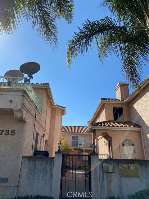735 W 10th Street 2 San Pedro, California Enter thru a gated courtyard to this Tuscany inspired townhouse. Centrally located close to shops and transportation makes this a unique find. A Private two car garage accesses the property. Entry level consists of one spacious bedroom with a private bathroom. Natural light is in abundance, with a breezy floor plan. On the top level of the townhome, there is an additional bedroom and bathroom, an open kitchen, a roomy and spacious living room with a cozy fireplace, and a large balcony that looks out to the fruit trees and courtyard. Granite kitchen with custom cabinets and stainless steel appliances including microwave and dishwasher. Additional features include a newly installed security system, ceiling fans, and new carpets. Washer and dryer hookups are ready for your convenience. Ready for immediate occupancy.