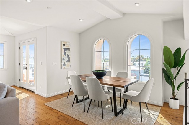 Light and bright dining area next to balcony #1.