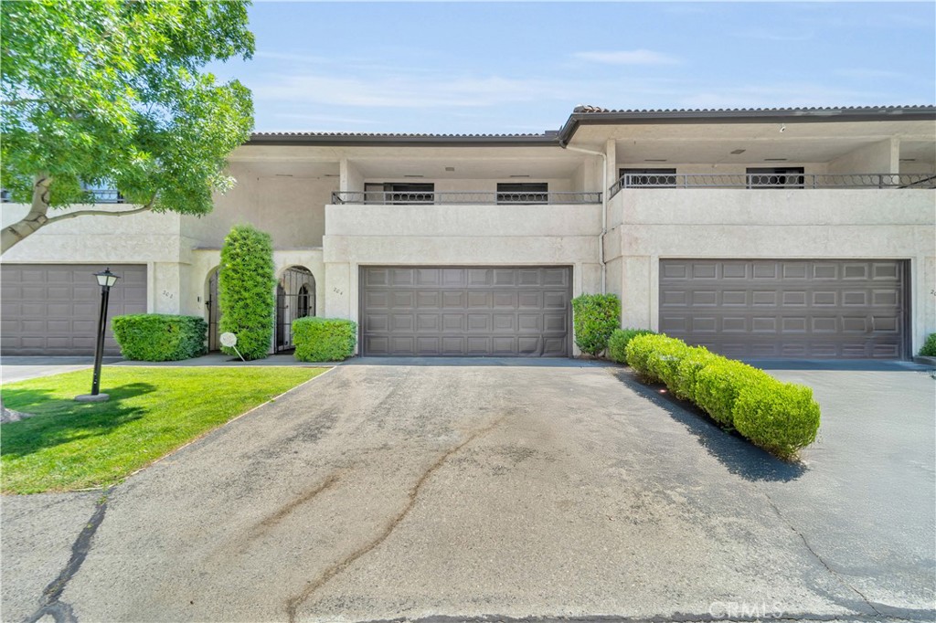 Enjoy low-maintenance living in the desirable Antelope Valley Country Club community! This spacious 3-bedroom, 2.5-bath condo offers nearly 2,000 sq. ft. just minutes from the 18-hole golf course, tennis courts, and clubhouse. The well-designed layout features large bedrooms, including a primary suite with a walk-in closet and private balcony—perfect for unwinding. The two additional bedrooms share a second balcony, offering extra storage or a quiet space to relax. A private patio off the downstairs living area adds great outdoor functionality. This community offers well-kept greenbelt areas for added privacy and serene surroundings. Water, exterior and roof maintenance are all included, making this home as practical as it is comfortable. With a newer HVAC system installed in 2021 and priced to sell, this is a must-see opportunity. Call today to schedule your private showing!