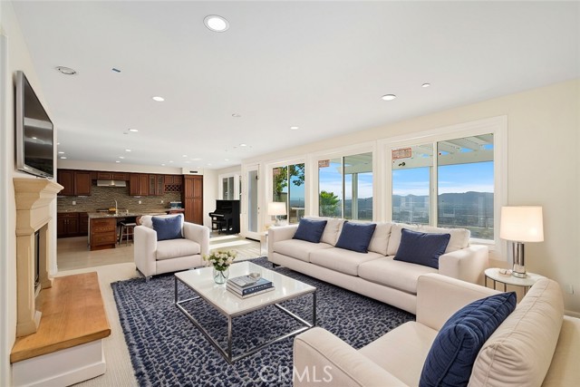 family room with theatre room and open concept kitchen /virtually staged