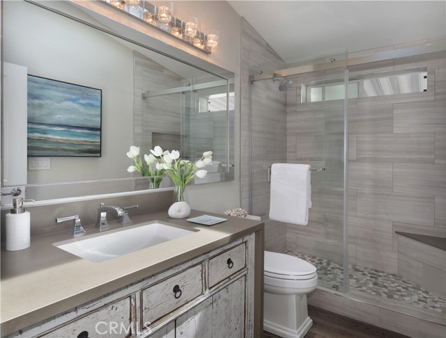 Secondary bath with walk-in shower.