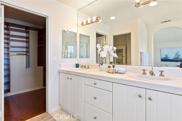 Owner's bath with dual vanities.