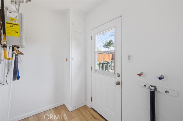 Tankless water heater. Back door to private, enclosed yard.