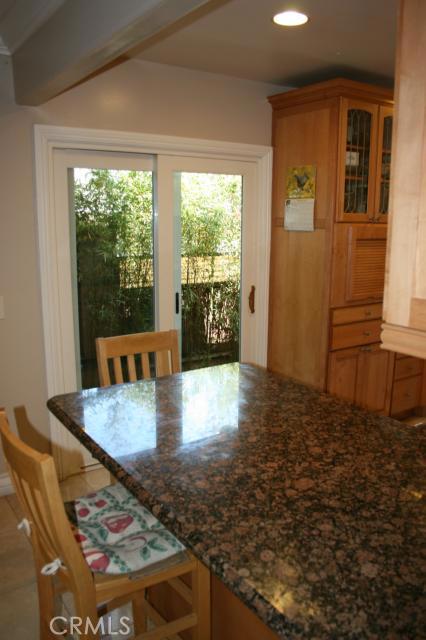 Sliding doors leading to side yard from kitchen.