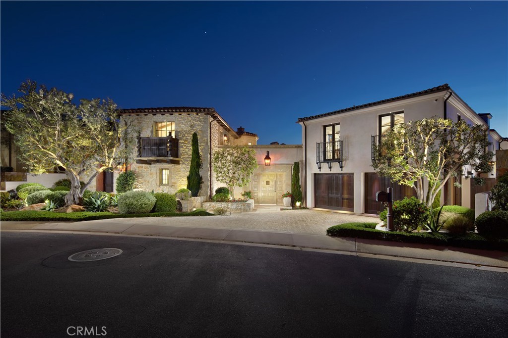Inspired by California’s iconic coastal towns—from La Jolla to Santa Barbara—17 Pacific Ridge Place was designed to embody timeless architecture rooted in European influences from Italy, France, and Spain. Rather than follow passing trends, the vision drew from architectural traditions with lasting resonance—resulting in a refined interpretation of California living. A tribute to coastal life, the estate blends the rarified ambiance of a private resort with comfort—set within The Strand at Headlands, Dana Point’s most coveted guard-gated beachfront community. Completed in 2016, this incomparable residence stuns with breathtaking whitewater views of the Pacific Ocean, dramatic coastline, sunsets, and Palos Verdes. Tucked along a quiet cul-de-sac, the home exudes stately elegance while keeping its many features discreetly out of view—creating a haven of private, comfortable living. Approximately 6,272 square feet, the residence features four en suite bedrooms and five-and-one-half baths, including a two-story guest house that makes it possible to enjoy two distinct one-bedroom suites, or one complete two-bedroom, two-bath hideaway joined by a staircase within its turret. A gallery-style entrance leads to the main home’s living spaces, including a great room that opens to the central courtyard and an ocean-view loggia, and a dining room that flows to the courtyard through an entire wall of fold-away glass doors. The ocean-view kitchen displays an island, nook, secondary catering kitchen, and top-of-the-line Sub-Zero, Wolf and Bosch appliances. Homeowners will appreciate the opulence of a main-level primary suite that overlooks the ocean, opens to the backyard, and showcases a freestanding tub and walk-in closet. Separate staircases lead to an ocean-view office or studio, and a massive media room with walk-in wet bar, bridge access to the casita, and a 110" screen with 4K projector. Nearly 14,700 square feet, the estate’s grounds enhance entertaining in a private central courtyard, and a backyard with covered loggia, outdoor kitchen and oversized spa. Residents here enjoy 24-hour guarded-gates, security patrol, and a 9,000-square foot beach club that Strand homeowners own exclusively. The private community borders the Dana Point Preserve, Harbor Point Conservation Park, and Hilltop Conservation Park for 70 acres of parks and picturesque trails.
