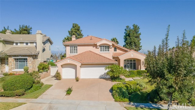 The front of the property boasts beautiful landscaping, enhancing its curb appeal