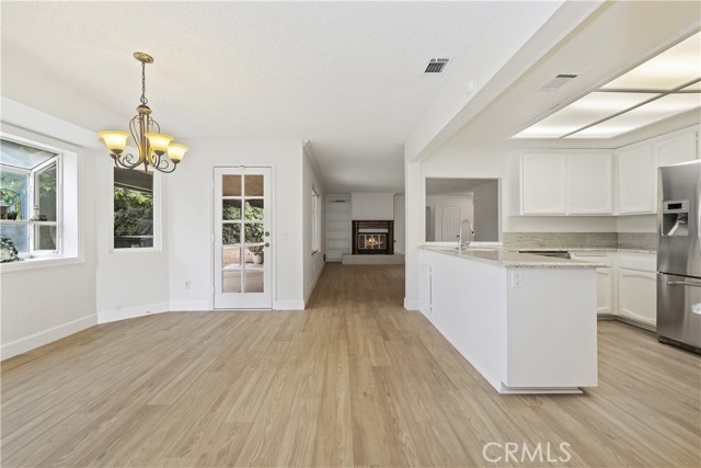 Another View of kitchen, eating area, access to patio and family room