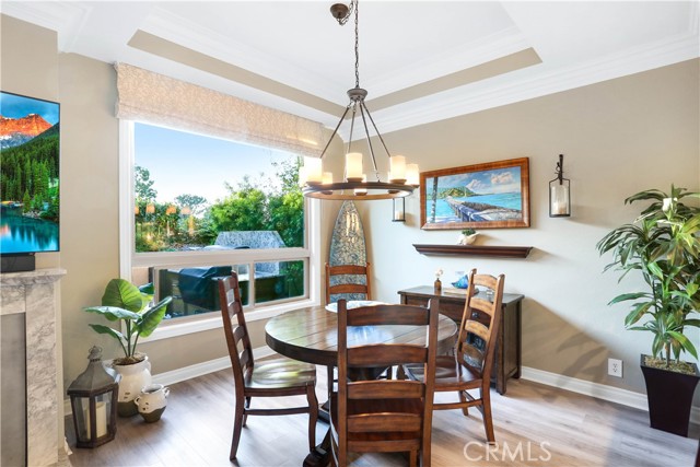 Well lit dining area adjacent to the kitchen.