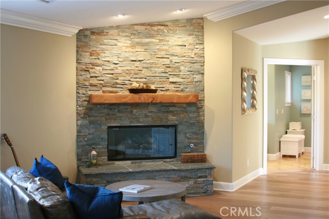 View of master retreat fireplace and doorway to master bathroom