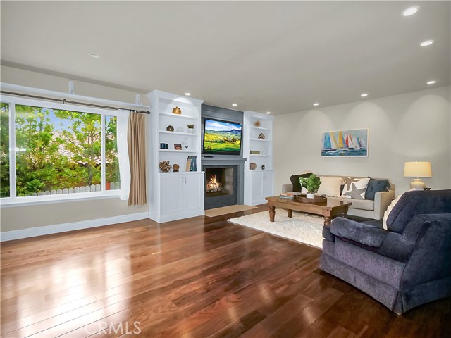 Family room with Fireplace, open to the kitchen.