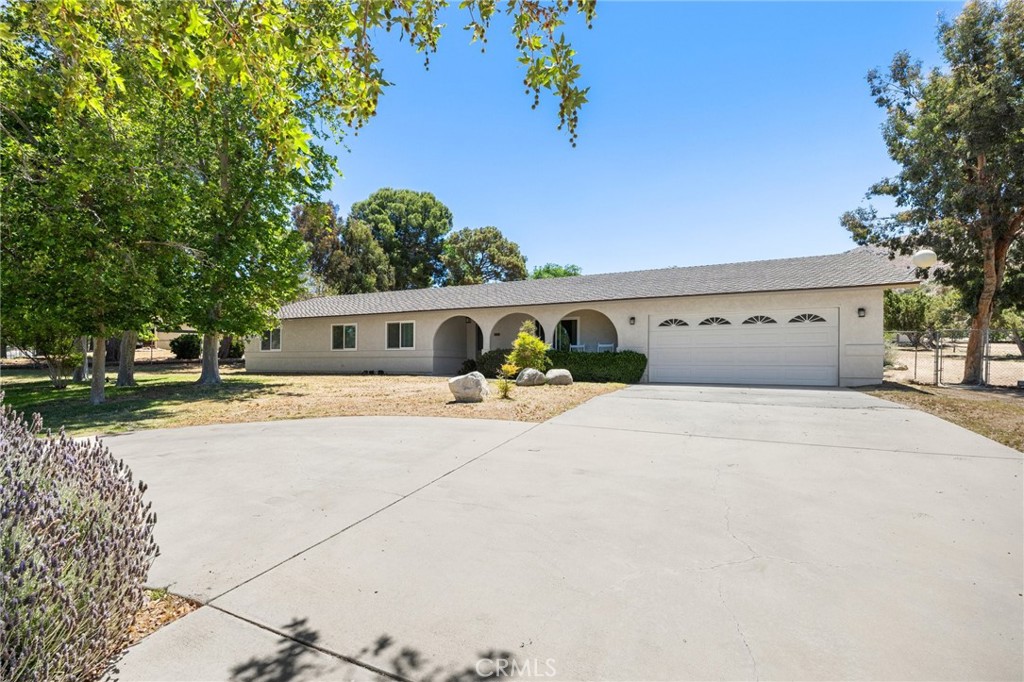 2532 Briar Glen Road Acton, California Nestled in the peaceful Country Way Estates neighborhood of Acton, this private, gated ranch-style home offers the perfect combination of modern living, equestrian amenities, and an expansive, beautifully landscaped lot. Set on 1.14 acres, this 1,731 sq ft single-story home features 4 spacious bedrooms and 2 bathrooms, along with a range of upgrades designed for both comfort and style. The home’s serene surroundings are enhanced by mature landscaping, providing privacy, shade, and a tranquil environment that complements the rural setting. Inside, the open floor plan flows effortlessly, making for a comfortable living space. The kitchen is a standout, featuring gorgeous granite countertops and stainless steel sink perfect for entertaining. Elegant travertine tile flooring throughout the main living areas, which adds a touch of sophistication and easy maintenance. Upgraded dual-pane windows enhance energy efficiency, keeping the home quiet and comfortable. The four bedrooms are generously sized, with the primary suite offering an en-suite bath for added privacy and convenience. A newer lifetime roof ensures peace of mind for years to come, making this home as durable as it is beautiful. For those with equestrian interests, this property is a dream come true. The fully functional horse arena is ideal for training or exercising, while the covered horse stalls provide shelter for your animals. Fenced turnouts offer plenty of space for your horses to roam, and there’s ample room for tack storage and trailer parking. The exterior of the home beautiful, with a private, gated entrance leading to the expansive lot. The flat, usable land is perfect for horses, RV parking, gardening, or even future expansions. A newer lifetime aluminum patio shade cover provides a comfortable space to enjoy the outdoors year-round, while you’re relaxing or hosting gatherings. The mature landscaping adds to the aesthetic appeal. Paved road access makes it convenient in all seasons. This home offers county water supply and natural gas--enjoy reliable utilities without the maintenance of a well. The central HVAC system ensures that your home remains comfortable no matter the temps outside. A 2-car extra deep garage, and a extra shed for storage space. There is ample parking with a large driveway, providing room for guests, trailers, or other vehicles. Enjoy this quiet, rural equestrian neighborhood, making it the ideal setting for your home purchase. Welcome Home!