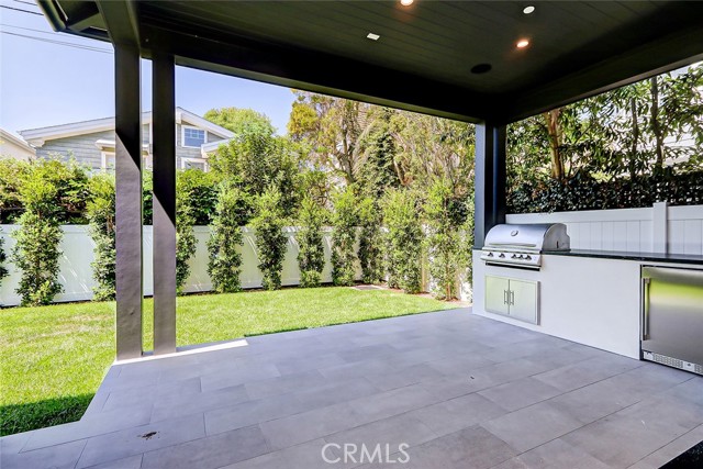 Patio area includes built-in barbecue and wine fridge