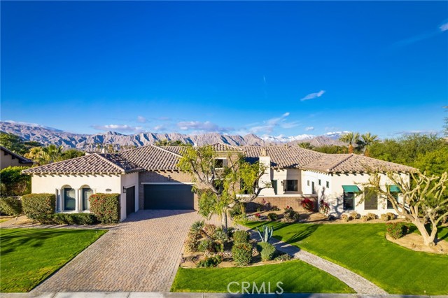 Former model home in the prestigious gated community of Madison Estates. This home has been completely updated with a private courtyard with a custom fireplace. This estate features 4 spacious bedrooms and 4.5 baths, Dining room features sliding doors that open to the courtyard. The Living room features vaulted ceilings and a custom built-in media niche & stone fireplace with raised hearth. The spacious kitchen offers an oversized island, custom quartz counter tops. The kitchen also has all Viking appliances and built-in Miele coffee system. The master bedroom en-suite features hardwood floors and a custom fireplace, with sliding doors leading to the backyard. The master bathroom features his and hers separate toilet rooms and a oversize soaking tub, dual vanities, massive walk-in shower enclosure with multiple shower heads for a spa like experience. His and her walk-in closets with custom cabinetry. There are 3 additional en-suite bedrooms with new hardwood floors and walk-in closets. The entertainer's yard has a covered patio, salt water, pebble tech pool and spa with a baja shelf. There is also a built-in gas BBQ and oversized yard. This home is a true entertainer's paradise. Other upgrades include newer a/c units, crown molding throughout and plantation shutters and much more! This estate is just steps from the world-famous Empire Polo Grounds.