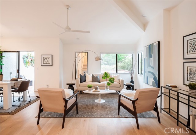 Living room with beautiful hardwood floors and natural light