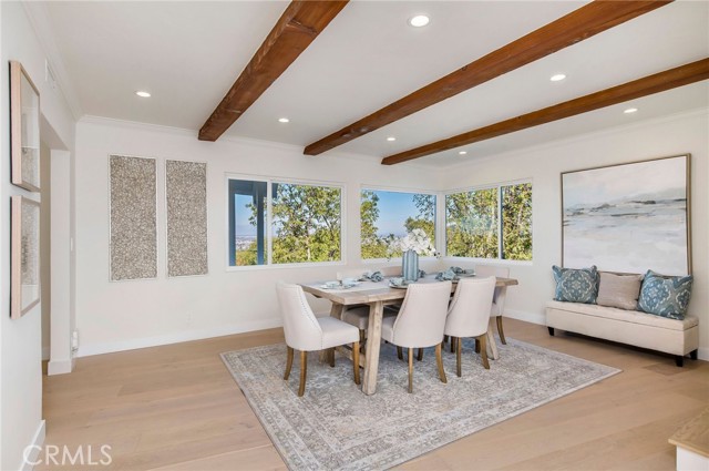 Formal Dining room with beamed ceiling