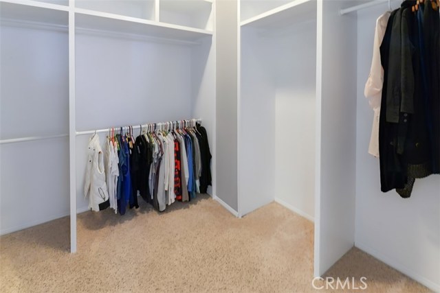 The master bedroom walk-in closet with new, custom, built-in closet organizers.