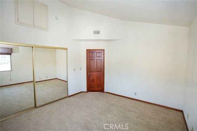 Bedroom #2: Vaulted ceiling, mirror closet doors.  Attic Access.