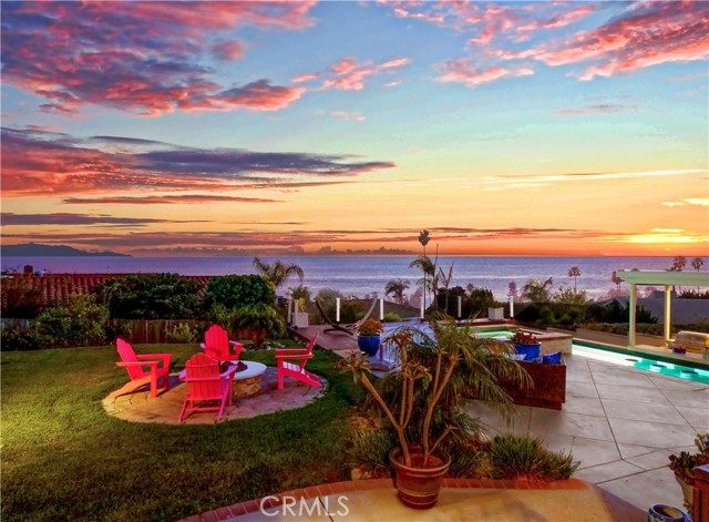 Backyard fire pit, pool and Catalina view beyond.
