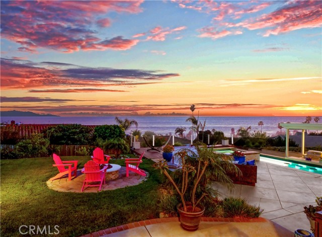 Backyard fire pit, pool and Catalina view beyond.