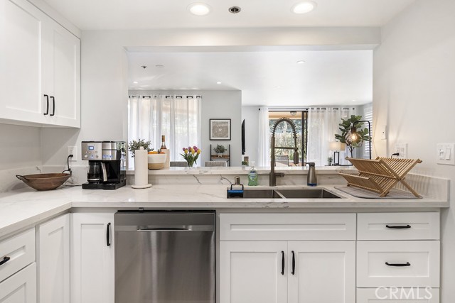Remodeled kitchen with stainless steel appliances, quartz countertops, newer cabinetry