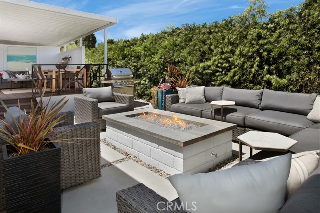 Outdoor living view onto deck and gas bar-b-que.