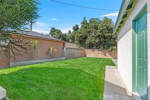 Backyard with 2 Car Garage and additional large storage shed all behind a private gate fence