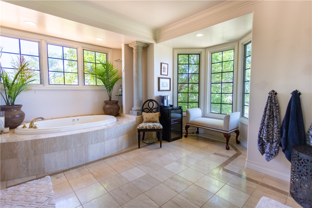 Who needs curtains when you have all of the privacy and spectacular views! You could put an Island in the middle of this bathroom!