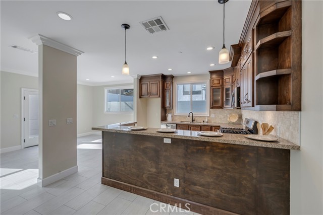 Expansive breakfast counter can hold 4 or 5 stools.