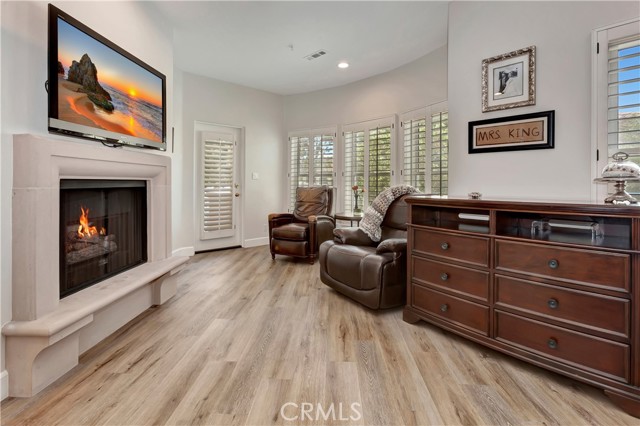 Primary bedroom sitting area with fireplace