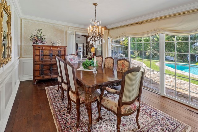 Lovely Traditional formal dining room with outdoor access. Peg and grove wood floors