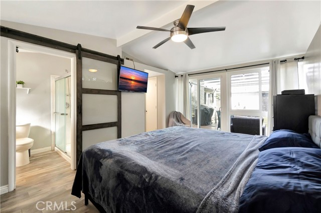 Primary suite with barn door and upgraded bathroom