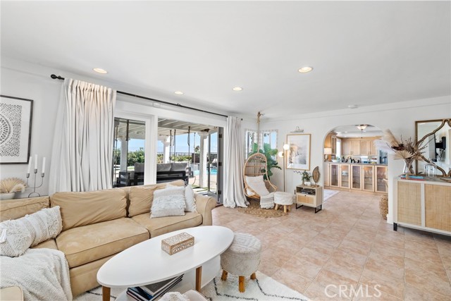 The family room's French doors, large pane windows, and picture window frame mesmerizing ocean views.