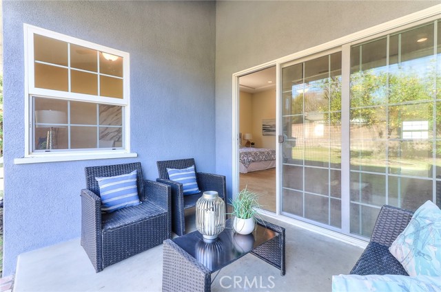 Sliding glass doors off the master suite to the backyard.