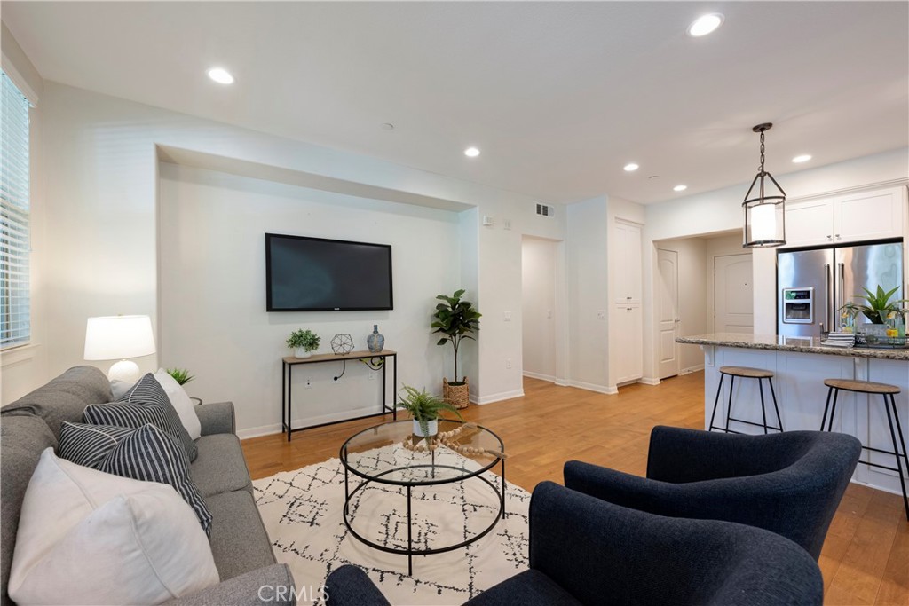Living Room with views of the Entryway and Kitchen!
