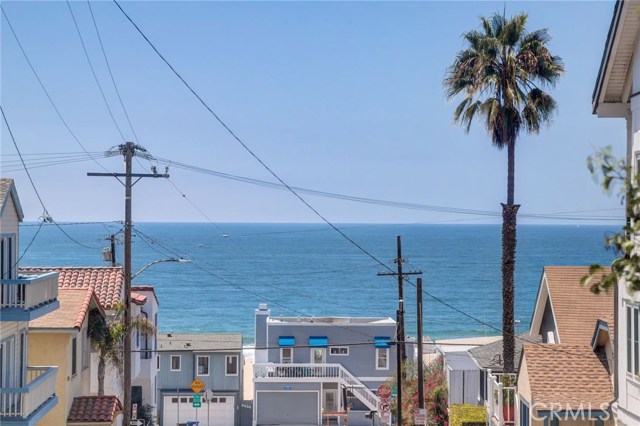 84 Manhattan Avenue Manhattan Beach, California Spectacular Ocean Views from every level of this beautifully maintained Pat Killen Design Townhome. Just 1 block to the Strand. Entertainers Dream!!Detached unit feels like a single family. Landscaped private rear patio. Each bedroom enjoys en-suite bathroom. Master Bedroom enjoys ocean view, fireplace, private patio, en-suite bath, jetted tub and stall shower. 2 large walk in closets. Kitchen features expansive ocean views, hardwood floors, large center island, Stainless steel appliances, & Granite counters. Spacious living and dining area. Direct access from 2 car garage, with guest parking.