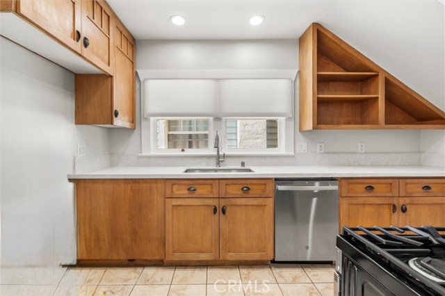 Updated kitchen with custom cabinets, new quartz countertop, sink, faucet and stainless steel appliances.