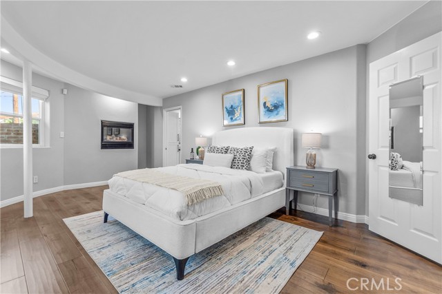 The elegant primary bedroom is a spacious suite where the Art Deco design continues.