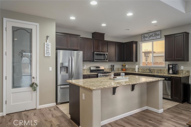 Shows pantry, granite countertops