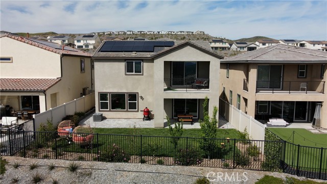 Backyard showing the fully paid solar panels